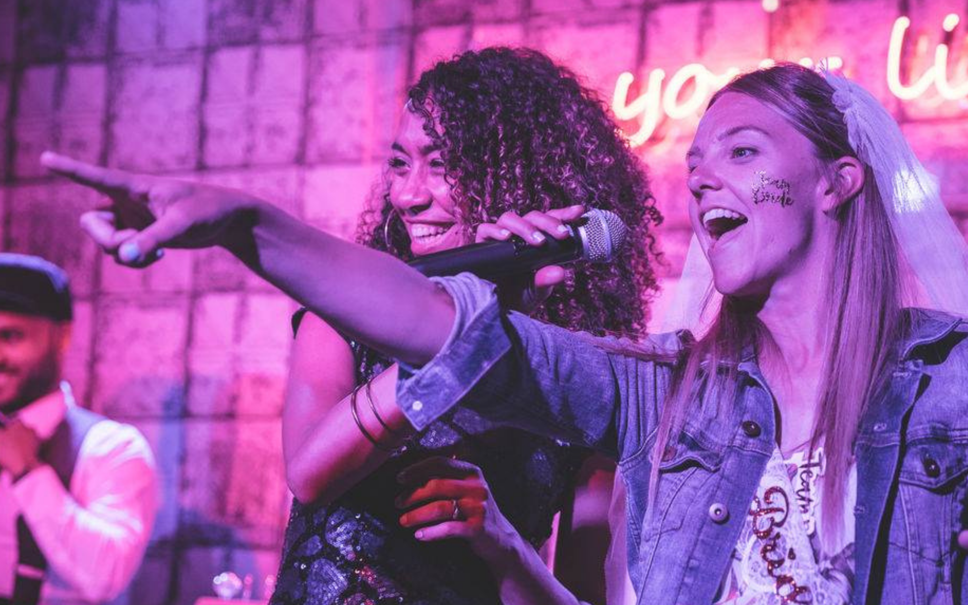 Singer interacting with a bride during a live performance